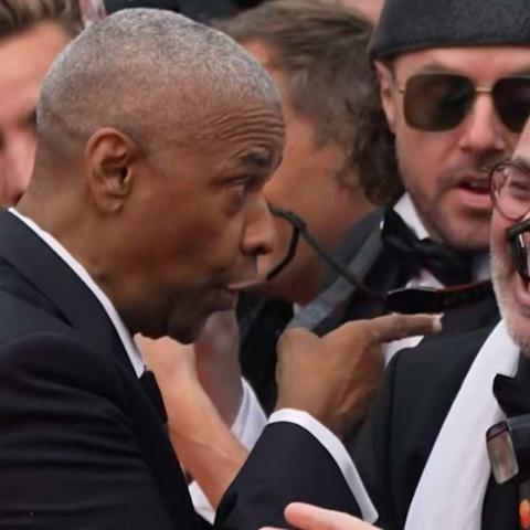 Denzel Washington discute con fotógrafo en la alfombra roja de Cannes