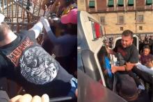 [VIDEO] Activista clava su mano en una cruz frente a Palacio Nacional exigiendo justicia
